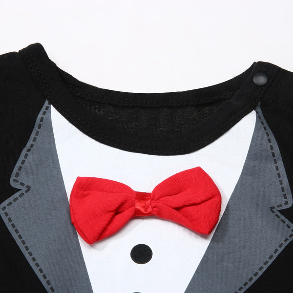 He is all dressed and ready for the special occasion, in his baby tuxedo black romper.  PRODUCT DETAILS  Attached red bowknot Crotch-snap buttons on the romper allow fuss-free diaper changes 100% Cotton Machine Washable