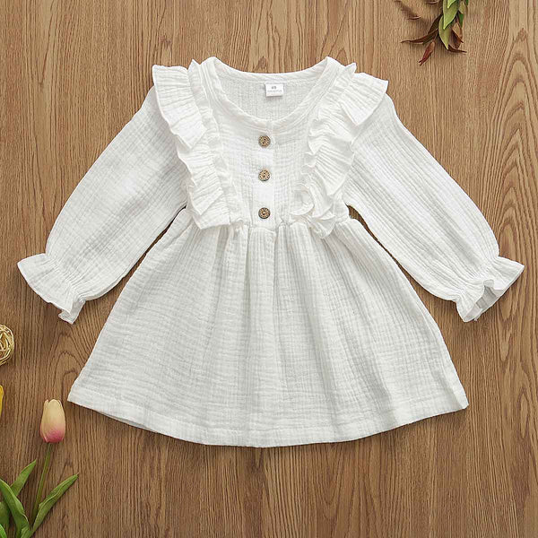 This dress is perfect for any day.  Your little girl will feel like a princess in our ruffle long sleeve dress.   PRODUCT DETAILS  Cotton  Knee-Length Crew neck Full Sleeve Ruffles at the shoulder and front and back A-Line Three Wooden Buttons