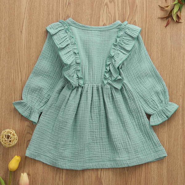 This dress is perfect for any day. Your little girl will feel like a princess in our ruffle long sleeve dress. PRODUCT DETAILS Cotton Knee-Length Crew neck, Full Sleeve ruffles at the shoulder and front and back A-Line, Three Wooden Buttons