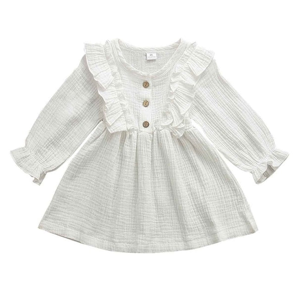 This dress is perfect for any day.  Your little girl will feel like a princess in our ruffle long sleeve dress.   PRODUCT DETAILS  Cotton  Knee-Length Crew neck Full Sleeve Ruffles at the shoulder and front and back A-Line Three Wooden Buttons