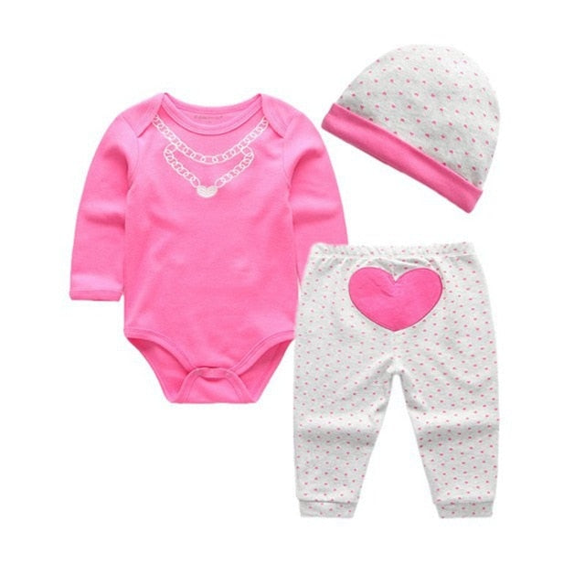 Graphic onesies are essential to every baby's wardrobe. This three-piece pink heart graphic long sleeve onesie, with pants and hat set, is great for any season.  PRODUCT DETAILS  Banded cuffs on cute pants with elastic waistband, Overlap shoulders on the onesie,  Crotch-snap buttons on the bodysuits allow fuss-free diaper changes 100% Cotton, Machine Washable 